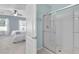 View from the bathroom to the bedroom, showing a shower with glass doors at 2354 Valhalla Dr, Tavares, FL 32778