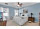 Charming bedroom featuring a ceiling fan, nightstands, and an abundance of natural light at 2354 Valhalla Dr, Tavares, FL 32778