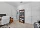A bedroom with a desk, bookcase and closet provides ample storage and organization options at 2354 Valhalla Dr, Tavares, FL 32778