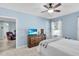 Bedroom with furniture and an open view to another room featuring a recliner at 2354 Valhalla Dr, Tavares, FL 32778