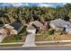 Lovely single-story home with a manicured lawn, mature trees, and an inviting driveway in a desirable neighborhood at 2354 Valhalla Dr, Tavares, FL 32778