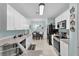 The kitchen offers stone countertops, white cabinets, and stainless steel appliances at 2354 Valhalla Dr, Tavares, FL 32778