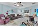 The living room features contemporary decor, modern flooring, and a sliding glass door at 2354 Valhalla Dr, Tavares, FL 32778