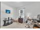 Office with a desk, chair, and shelves, illuminated by natural light from the window at 2354 Valhalla Dr, Tavares, FL 32778
