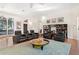 Spacious living room boasts a cozy seating area with a unique modern coffee table and plush rug at 38230 Yale Cir, Leesburg, FL 34788