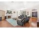 Bright and airy living room with fireplace, hardwood floors, and abundant natural light at 38230 Yale Cir, Leesburg, FL 34788