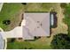 Aerial shot of a well-maintained home with a screened-in pool and manicured landscaping at 5009 Harbor Hts, Lady Lake, FL 32159