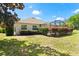 Private backyard with a screened lanai, perfect for outdoor enjoyment at 5009 Harbor Hts, Lady Lake, FL 32159