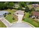 Well-kept home featuring a two-car garage, manicured landscaping, and a spacious front yard at 5009 Harbor Hts, Lady Lake, FL 32159
