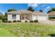 Charming home with well-manicured front lawn and garden at 5009 Harbor Hts, Lady Lake, FL 32159