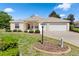 Well-kept home showcasing manicured front yard with beautiful landscaping at 5009 Harbor Hts, Lady Lake, FL 32159