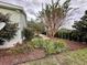 Landscaped yard with a winding stone path and lush plants at 558 Saint Andrews Blvd, The Villages, FL 32159