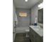 Updated bathroom features marble tile, new vanity with white countertop, and updated fixtures at 11 The Crescent, Minneola, FL 34715