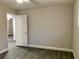 Spacious bedroom featuring wood-look flooring and fresh neutral paint, ready for personalization at 11 The Crescent, Minneola, FL 34715