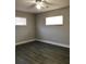 Bedroom features neutral walls, new vinyl floors, and natural light at 11 The Crescent, Minneola, FL 34715