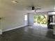 Bright open-concept living space with backyard views and modern ceiling fan at 11 The Crescent, Minneola, FL 34715