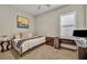 Guest bedroom featuring a trundle bed, large window, and a modern desk at 955 Ladera Ranch Rd, Kissimmee, FL 34759