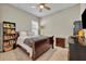 Cozy bedroom featuring a ceiling fan, one window, and neutral decor at 955 Ladera Ranch Rd, Kissimmee, FL 34759