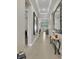 Bright hallway with tile flooring and decorative accents leading to the living areas at 955 Ladera Ranch Rd, Kissimmee, FL 34759