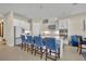 Spacious kitchen with large island, seating, white cabinets, and stainless steel appliances at 955 Ladera Ranch Rd, Kissimmee, FL 34759