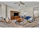 Inviting living room with a large sectional sofa, entertainment center and natural light at 955 Ladera Ranch Rd, Kissimmee, FL 34759