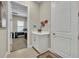 Mudroom boasting white cabinetry, modern finishes, and access to office space at 955 Ladera Ranch Rd, Kissimmee, FL 34759