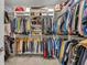 Organized walk-in closet featuring shelving and hanging rods to maximize storage at 955 Ladera Ranch Rd, Kissimmee, FL 34759