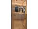 Well-lit bathroom with vanity, storage, and mirrored closet doors at 103 Fountain Cv, Leesburg, FL 34748