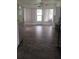 Bright dining room, featuring tile flooring, with exterior access and ample storage at 103 Fountain Cv, Leesburg, FL 34748