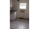 The kitchen boasts natural light and lots of storage at 103 Fountain Cv, Leesburg, FL 34748