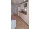 Classic kitchen with white cabinets, countertops, and modern appliances at 103 Fountain Cv, Leesburg, FL 34748
