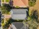 Birds eye view of a well-maintained home featuring a modern roof with verdant landscaping at 1063 Mesa Verde Ct, Clermont, FL 34711
