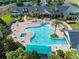 Enjoy the community pool with ample seating and lush landscaping at this resort style community at 1063 Mesa Verde Ct, Clermont, FL 34711