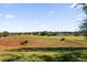 Picturesque backyard featuring a stunning golf course view, perfect for relaxation and recreation at 1063 Mesa Verde Ct, Clermont, FL 34711