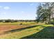View of golf course from backyard on a sunny day at 1063 Mesa Verde Ct, Clermont, FL 34711