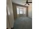 Bedroom with neutral walls, carpet, ceiling fan, and bright bay window at 1063 Mesa Verde Ct, Clermont, FL 34711