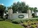 Summit Greens neighborhood entrance sign surrounded by lush landscaping at 1063 Mesa Verde Ct, Clermont, FL 34711