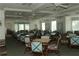 The dining room has seating for many, with ceiling fans and lots of light at 1063 Mesa Verde Ct, Clermont, FL 34711