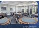 Community game room with multiple tables and chairs at 1063 Mesa Verde Ct, Clermont, FL 34711