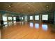Spacious fitness room with mirrored walls and plenty of natural light at 1063 Mesa Verde Ct, Clermont, FL 34711