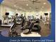 Well-equipped gym with modern treadmills, stationary bikes, and fitness equipment for a complete workout experience at 1063 Mesa Verde Ct, Clermont, FL 34711