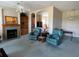 Inviting living room with fireplace, shelving, and comfortable seating at 1063 Mesa Verde Ct, Clermont, FL 34711