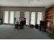 Large living room with lots of natural light coming in through the glass doors at 1063 Mesa Verde Ct, Clermont, FL 34711