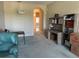 Open concept living room with workspace featuring custom built-ins and great natural light at 1063 Mesa Verde Ct, Clermont, FL 34711
