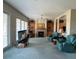 Inviting living room with a fireplace, shelving, and abundant natural light at 1063 Mesa Verde Ct, Clermont, FL 34711