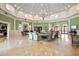 Elegant lobby featuring a soaring ceiling, chandelier, and comfortable seating at 1063 Mesa Verde Ct, Clermont, FL 34711