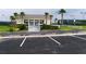 Paved parking lot in front of a building with neatly marked spaces and palm trees, ensuring convenient access at 1063 Mesa Verde Ct, Clermont, FL 34711