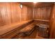 Beautiful wood sauna with benches and heater for relaxation and wellness at 1063 Mesa Verde Ct, Clermont, FL 34711