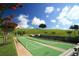 Enjoy the shuffleboard courts with scenic green surroundings and beautiful landscaping at 1063 Mesa Verde Ct, Clermont, FL 34711