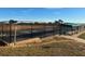Tennis court with shaded seating area, perfect for enjoying a match with friends at 1063 Mesa Verde Ct, Clermont, FL 34711